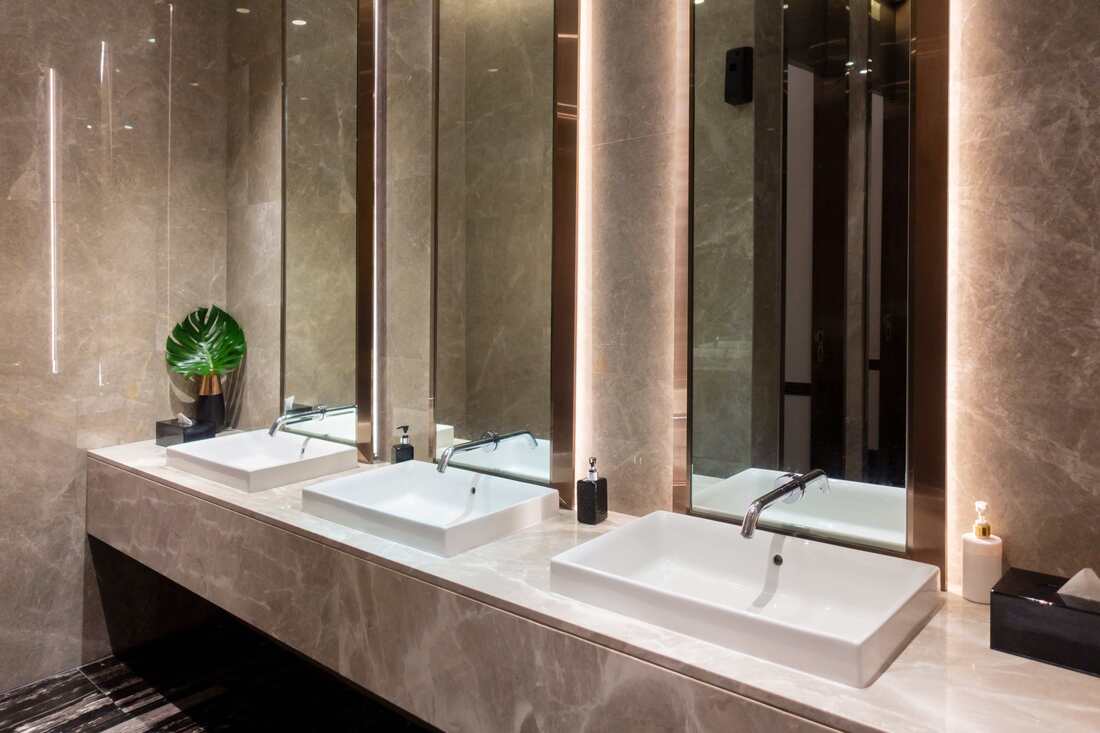 A commercial client of ours was looking to renovate their bathrooms. They wanted a luxury feel to their bathroom and we were able to provide that through the materials used and the lighting.