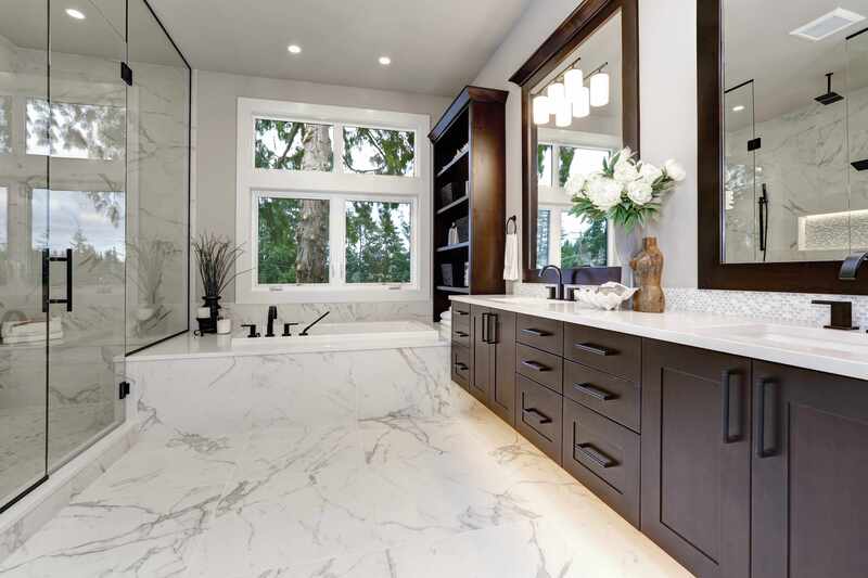 Marble flooring was installed in this bathroom to match the rest of the finishing.