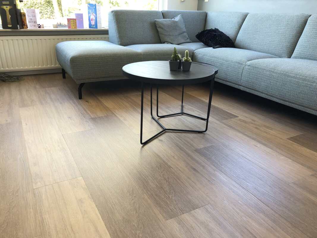 Vinyl flooring was used over hardwood as our client was on a budget. 
